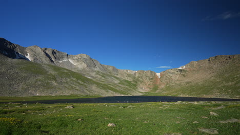 cinematic late morning denver summit echo chicago lakes mount evans 14er front range foothills rocky mountains idaho springs evergreen squaw pass slow motion wide scenic landscape pan to the left