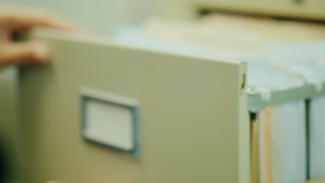 opening filing cabinet drawer