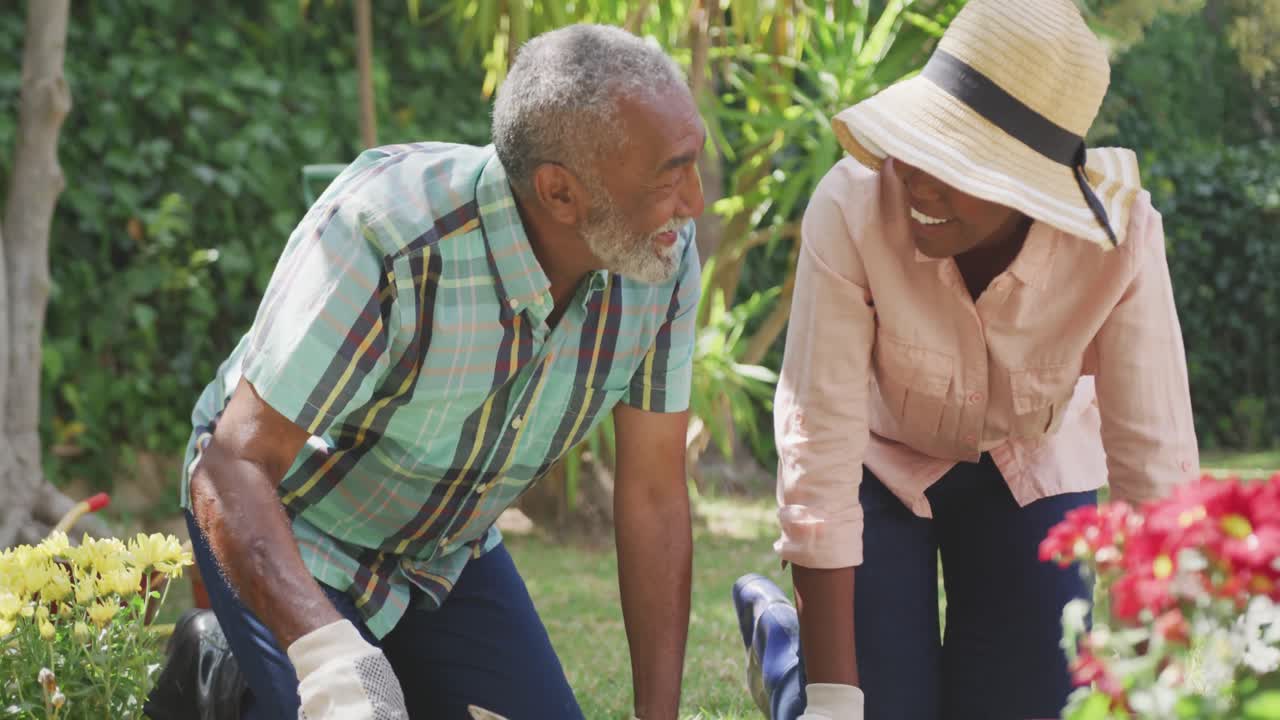 Father and daughter gardening during a sunny day