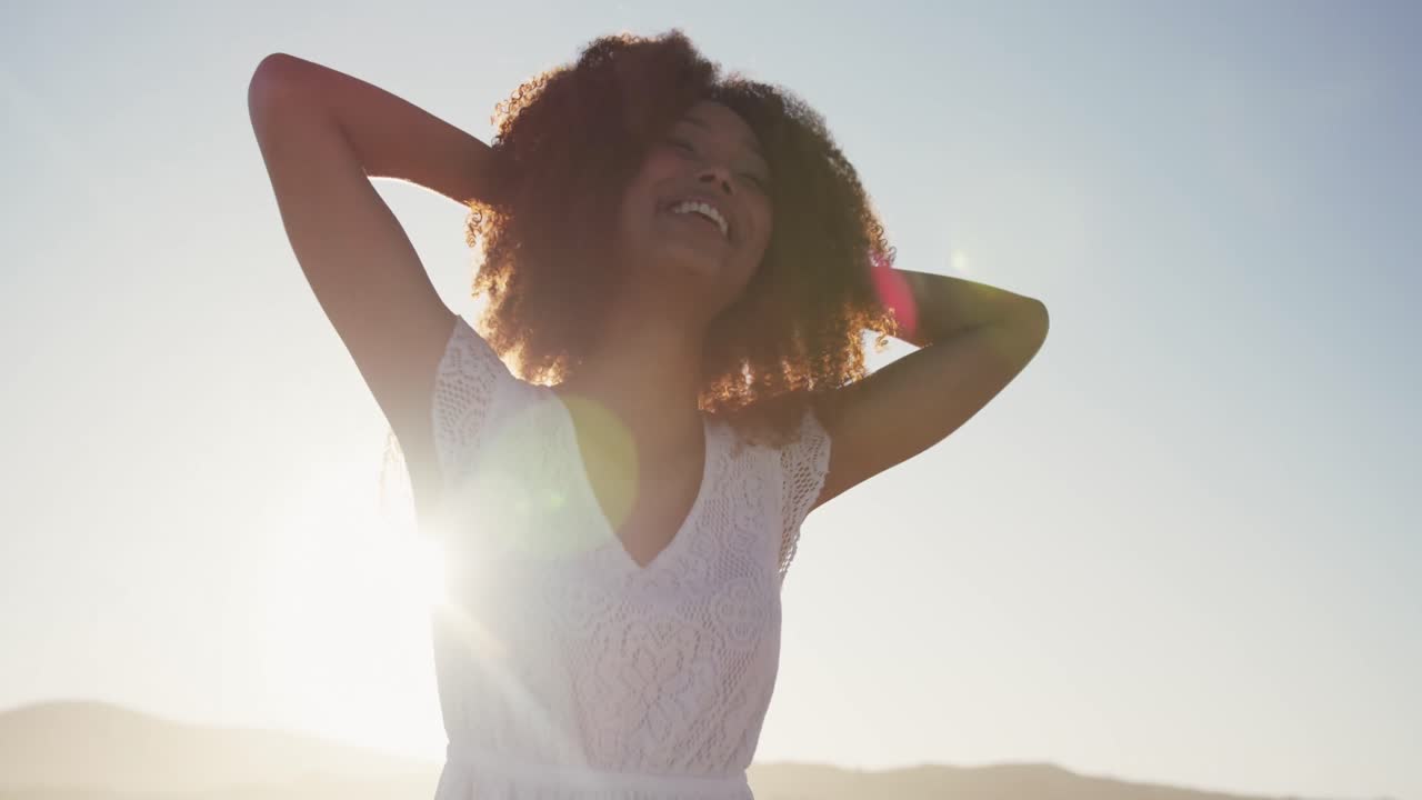 Portrait of African American woman enjoying at beach
