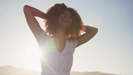 portrait of african american woman enjoying at beach