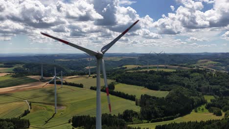 wind turbines overlooking the eifel region, hills, clean energy from the wind. aerial video