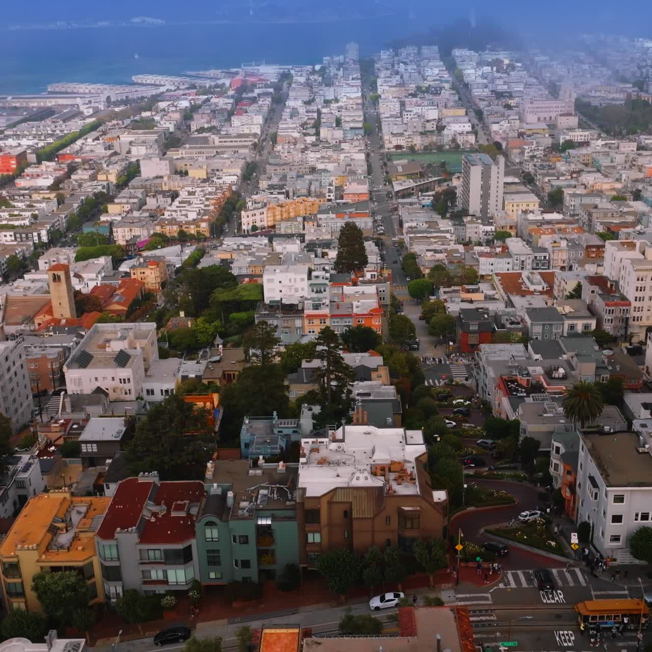 Lovely cozy architecture of beautiful San Francisco, California, USA. Thick mist at backdrop. Top view
