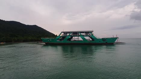 Close-Up-shot-of-A-Ferryboat-Loaded-with-Cars-and-People-Enters-the-Port-of-the-Koh-Chang-Island-from-Mainland,-Thailand