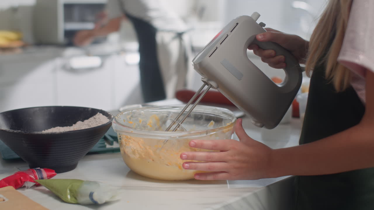 Unrecognizable Kid Mixing Dough for Cookies