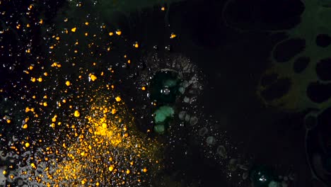 abstract liquid art with golden and green splashes