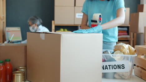 volunteers packing donations at a food bank