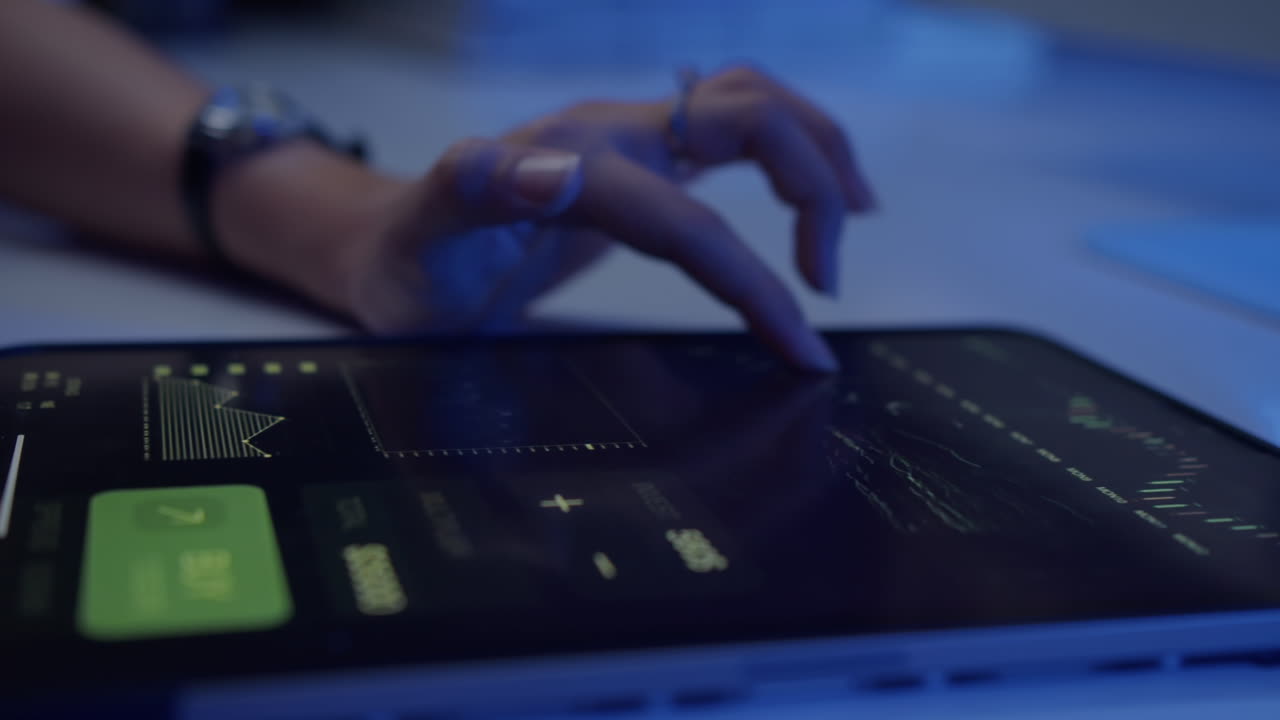 Unrecognizable Woman Checking Charts on Tablet PC in Neon