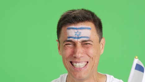close up of a man supporting israeli team
