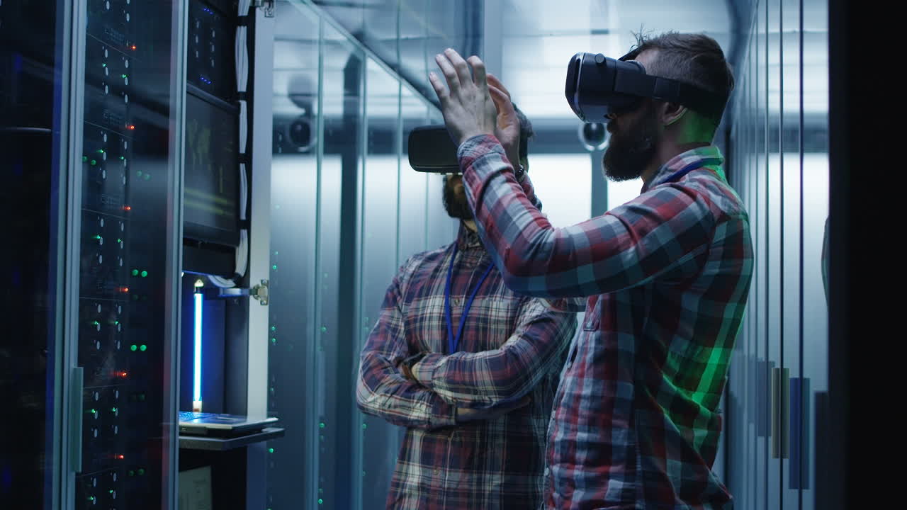 Two men using virtual reality headsets in a data center