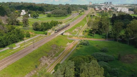 elevated drone shot of train passing by