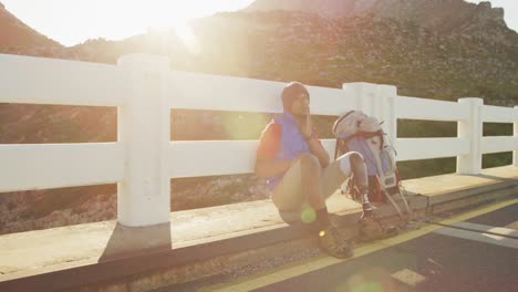 sporty mixed race man with prosthetic leg enjoy his hike