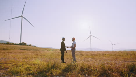 business deal at wind farm