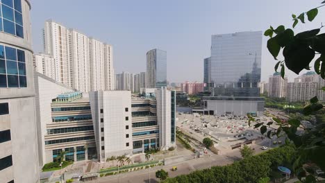 time-lapse overlooking business district of gurugram with apartments and offices during a summers day in india