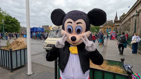 costumed character entertains at busy festival crosswalk