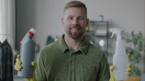 man holding cleaning supplies