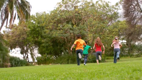 happy children running at the park