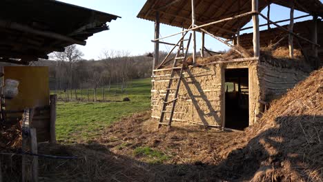 old damaged stable for animals made from clay