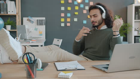 relaxed office worker listening to music