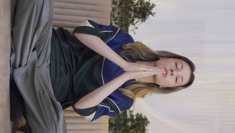 vertical video of christian young woman praying.