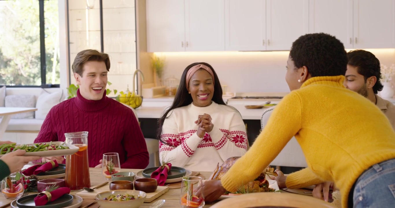 Diverse Group of Friends Preparing a Festive Holiday Dinner Together
