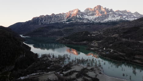 winter sunrise over alpine lake