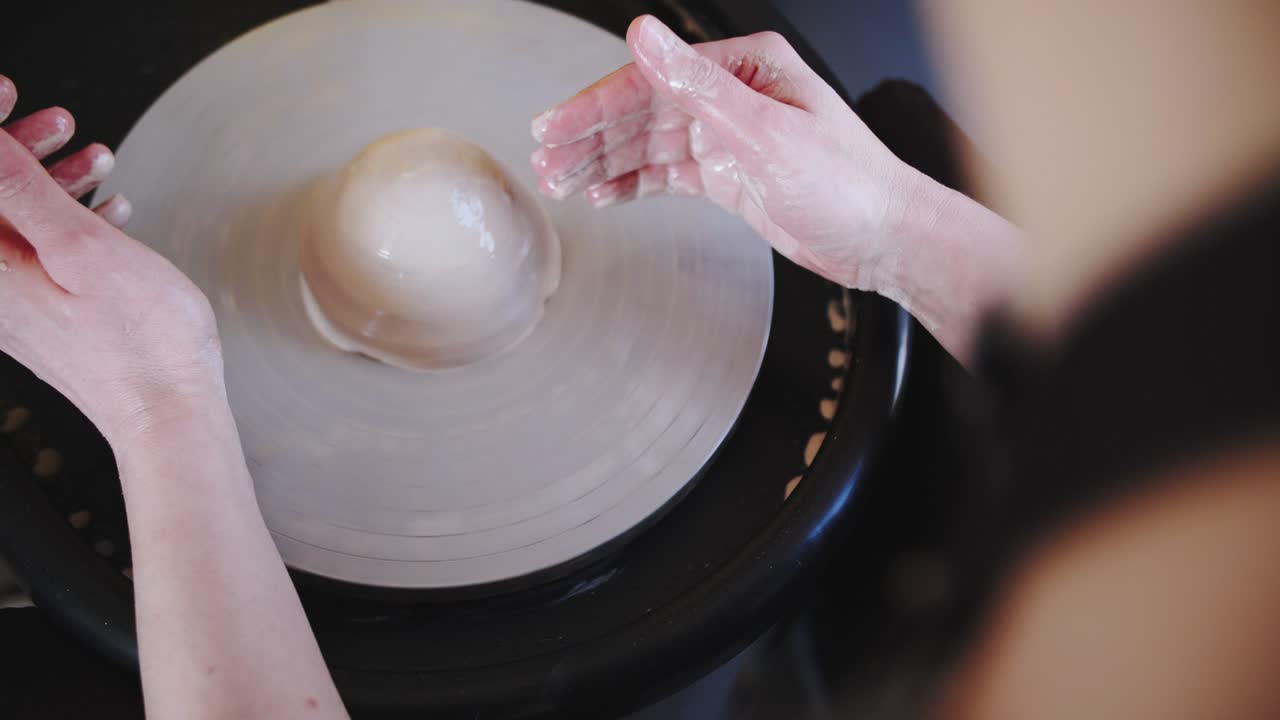 Potter's wheel potter works with his hands