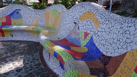 Creative-colorful-mosaic-bench-in-La-Palma,-El-Salvador,-city-of-art