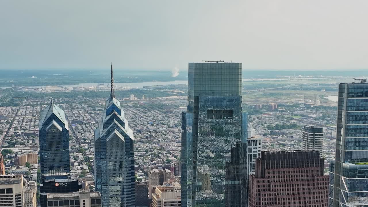 Drone view of Philadelphia skyline showcasing iconic buildings and river