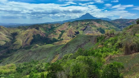 idyllic drone shot showing green nature hills of southern mindanao in province of south cotabato, philippines