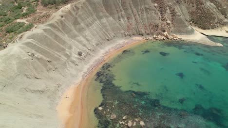 stunning clay cliffs in qarraba bay. charming bay in malta with turquoise water