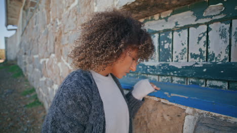 upset girl looking away at abandoned place closeup. stressed model thinking