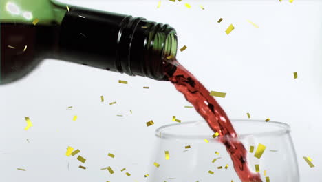 animation of confetti falling over bottle of wine on white background