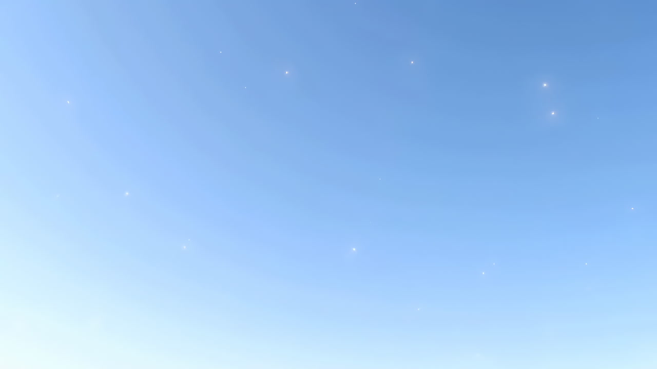 澄み切った青空にきらめく光の粒子が漂う
