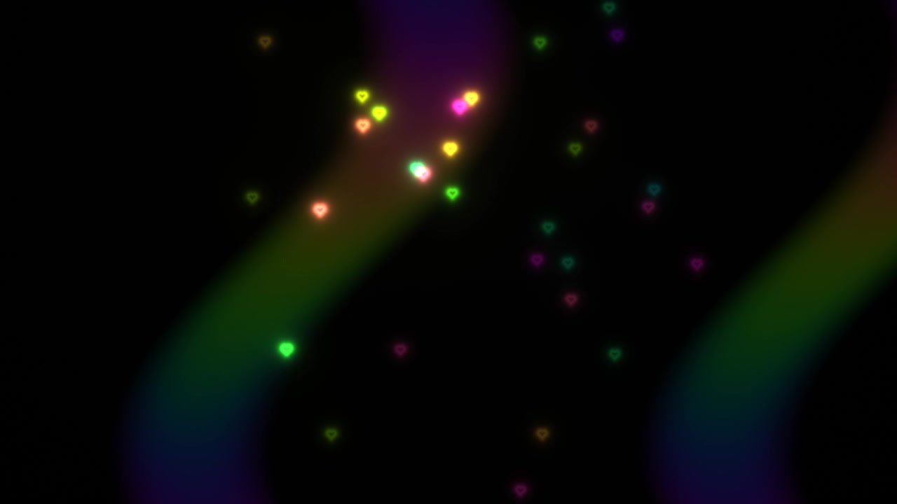 Colorful particles move in various directions against a dark background. The scene captures a mix of lights floating with an abstract wave pattern, creating a vibrant visual effect