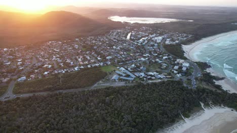 aerial view of coastal town at sunset