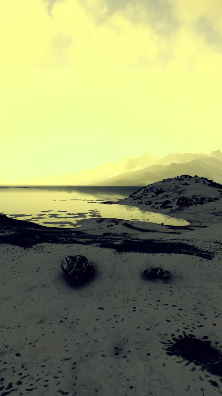 Stunning landscape view of a serene lake and mountains at sunset