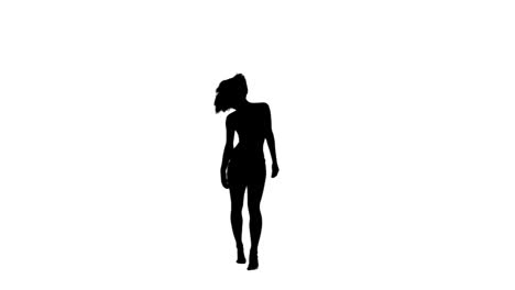 silhouette of a dancing woman on her own