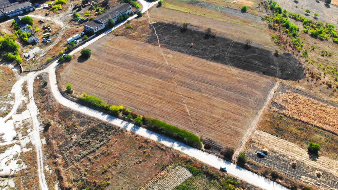 Aerial drone view of Maramonovca village among fields and green hills in Moldova