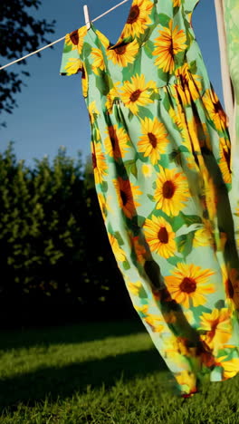 sunflower dress hanging on a clothesline