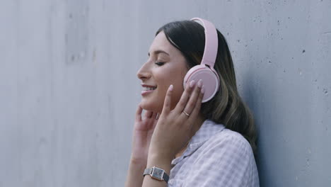 women listening to music on bluetooth headphones