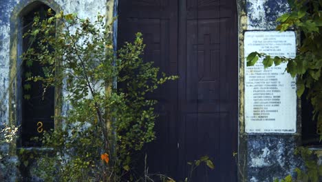 entrance doors of an monastery in the middle of the forest