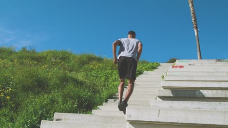 black athlete running up steps