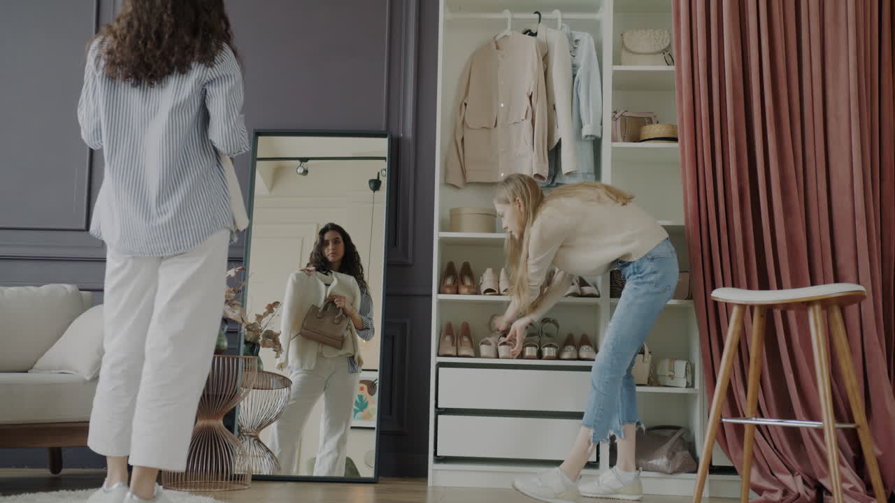 Two women trying on clothes in a dressing room