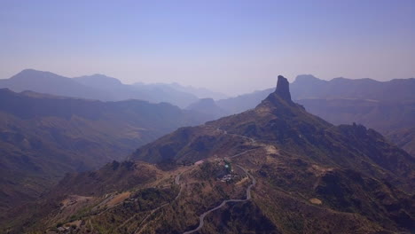 Cliff-forest-mountan-drone-flyover-of-foggy-Bentayga