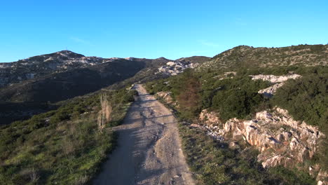 Drone captures the magic of Penteli&#039;s sunset over its gravel road