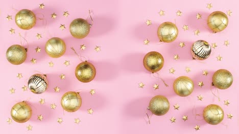 gold christmas ornaments appear on left and right side of pastel pink theme. stop motion