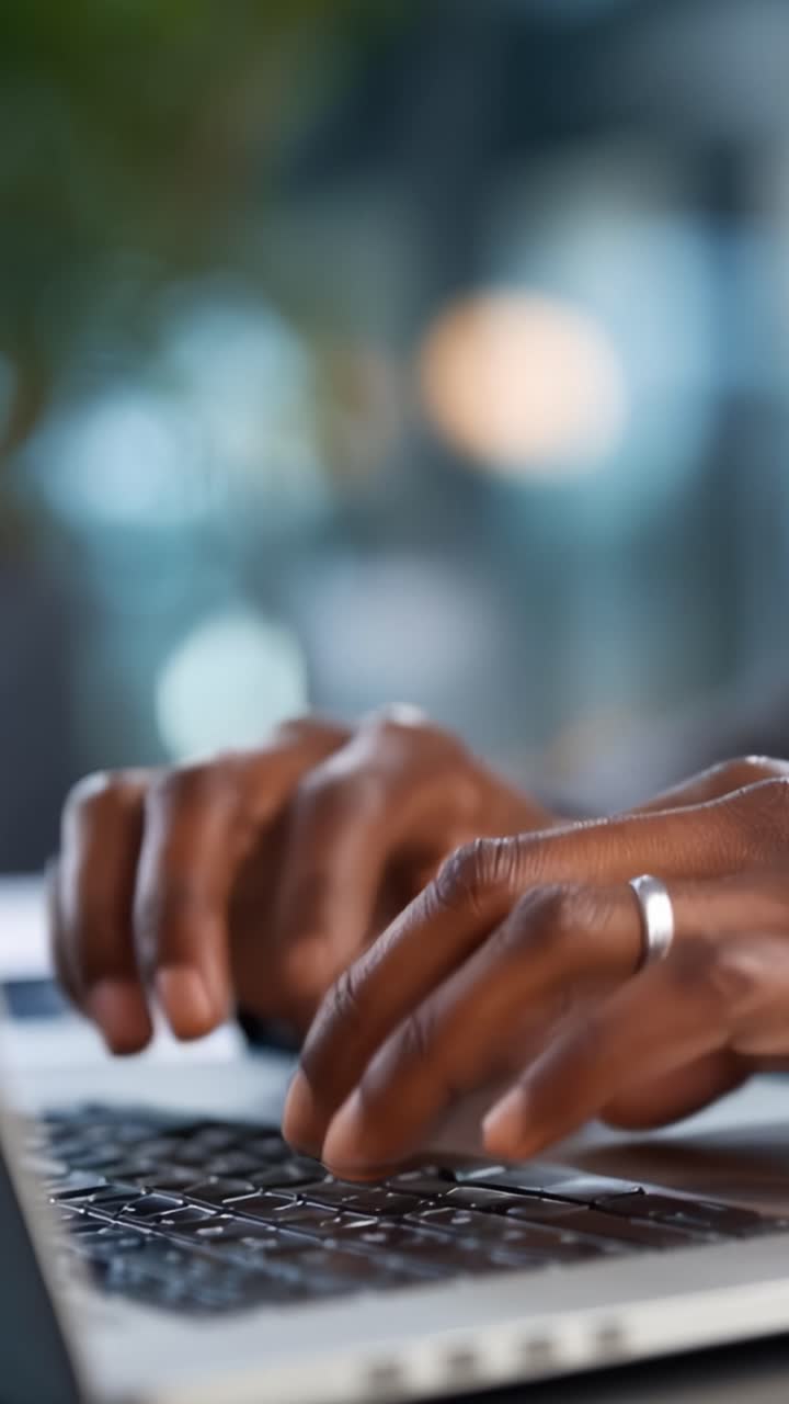 Focused hands typing on a laptop keyboard, showcasing engagement and productivity in a dynamic work environment, emphasizing digital interaction and technology skills