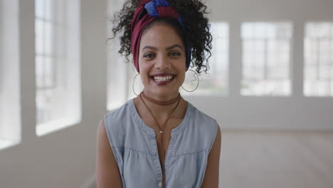 portrait of young independent hispanic woman laughing cheerful proud enjoying successful lifestyle change in new apartment
