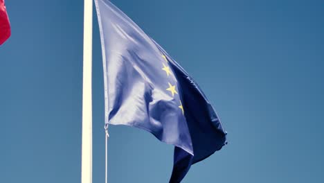 european union flag waving in the air